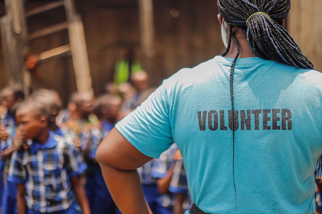 Volunteer Watching Schoolboys